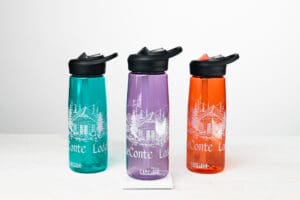 leconte lodge camelbak water bottle in teal, purple, and orange.