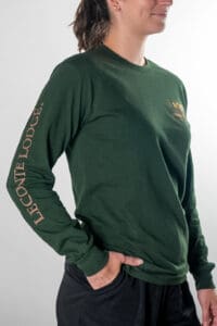 woman wearing leconte lodge 100th anniversary long sleeve short in forest