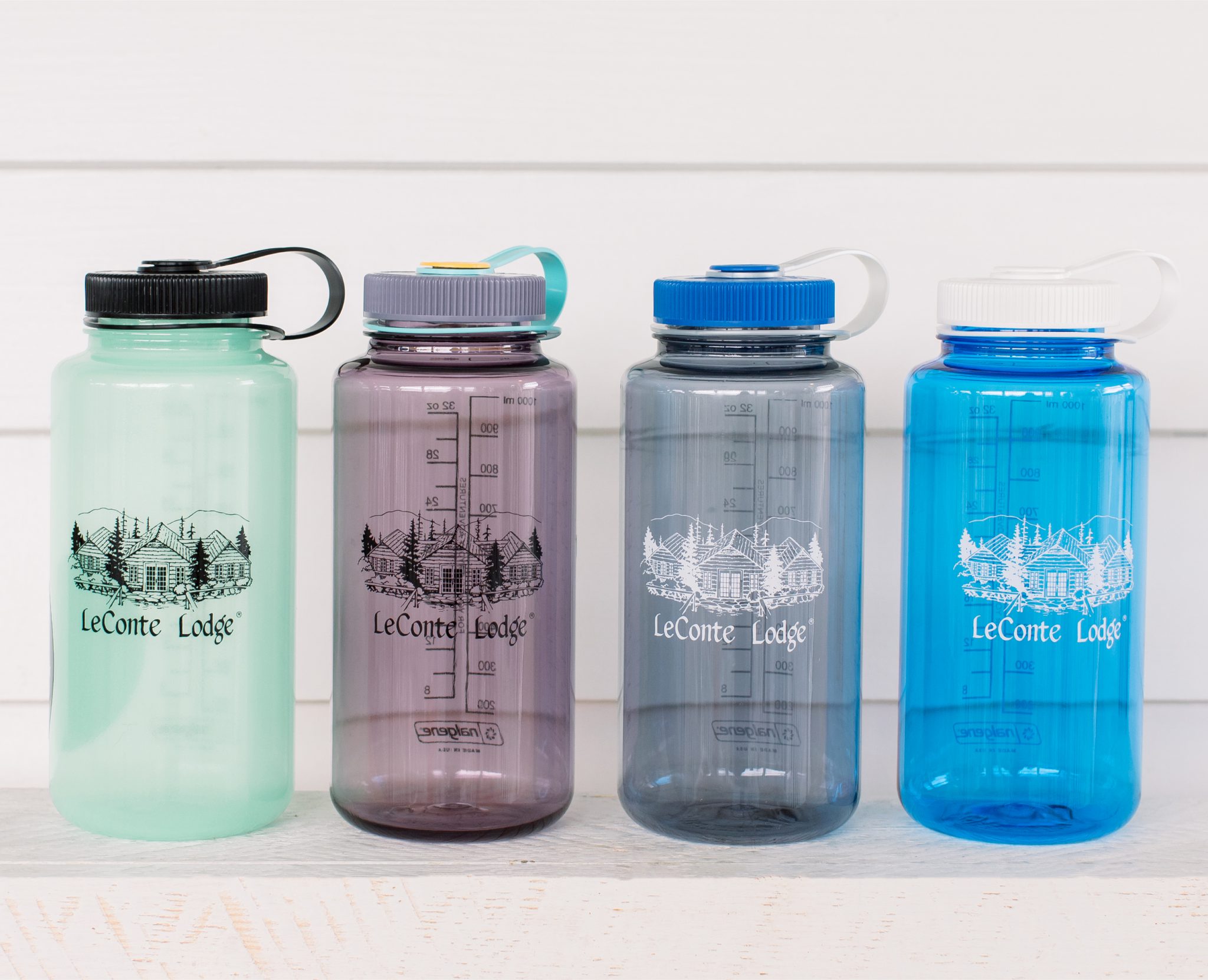 four plastic water bottles
