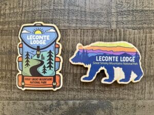 two wooden stickers